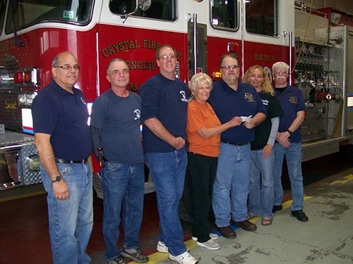 Check presented to the Crystal Fire Dept from mass collection and Bavarian Fall Fest